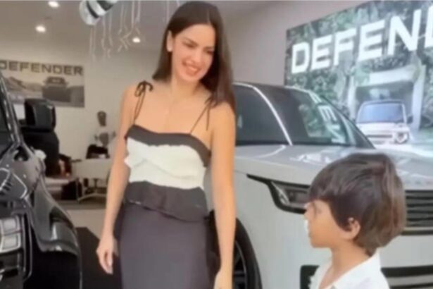 Natasa Stankovic posing with Land Rover Defender and son Agastya