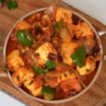Homemade Paneer Shimla Mirch prepared with paneer cubes, capsicum, onions, tomatoes, and aromatic Indian spices.