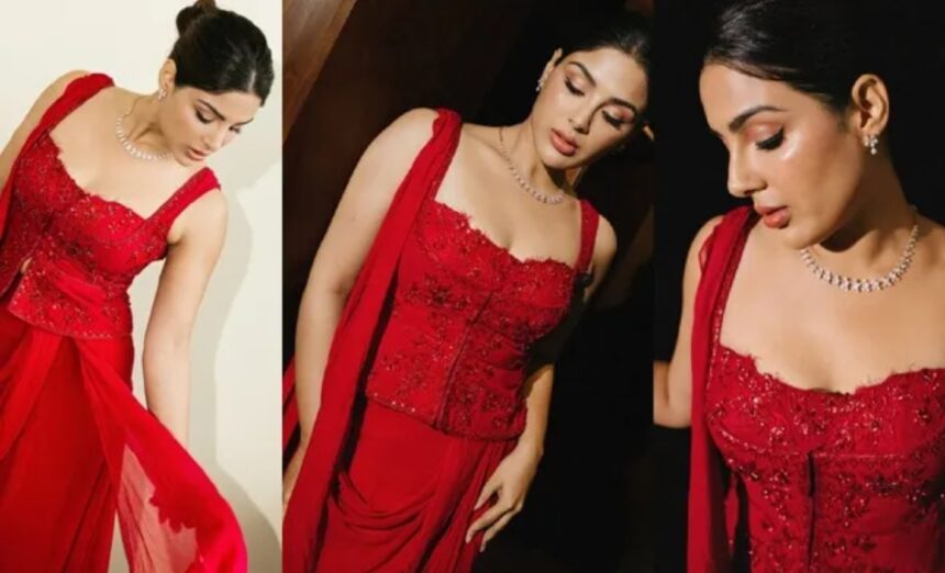 Samyukta Menon wearing an elegant red sleeveless dress with minimal accessories.
