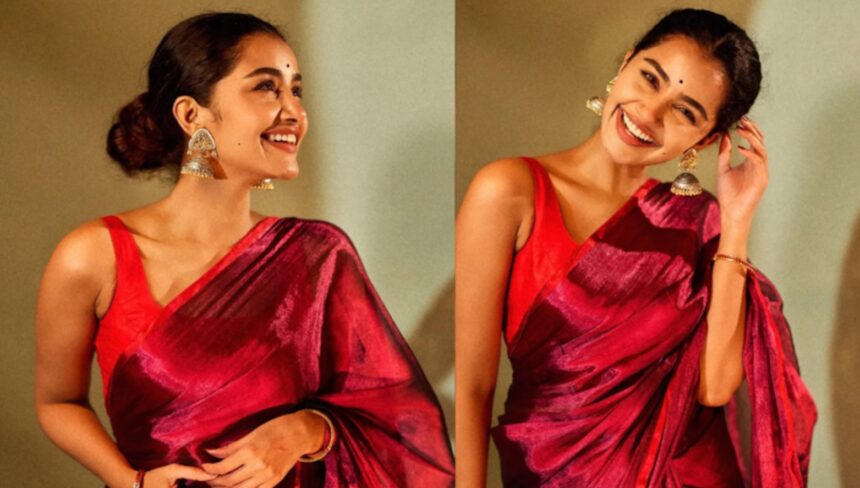 Anupama Parameswaran wearing a silk tissue saree with statement jhumkas.